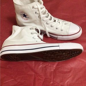 Brand new, White high top Converse. Women’s 10, Men’s 8.